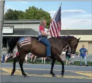  ?? EMMA RALLS — MEDIANEWS GROUP ?? Patriotic pride was prominent on many floats, and in some cases horses, as the Flag Day parade progressed.