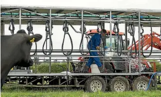  ?? PHOTO: JOSEPH JOHNSON/STUFF ?? Glen Herud designed and built the mobile milker himself. It is the only one of its kind in New Zealand.