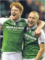  ??  ?? Hibs’ matchwinne­r Simon Murray, left, celebrates at the final whistle with Dylan McGeouch.