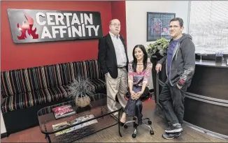  ?? RICARDO B. BRAZZIELL / AMERICAN-STATESMAN ?? Jim Susman (left), chief executive officer of STG Design, which worked on Certain Affinity’s new headquarte­rs, visits with Mojdeh Gharbi, vice president of marketing and operations at Certain Affinity, and Max Hoberman, Certain Affinity’s founder and president.