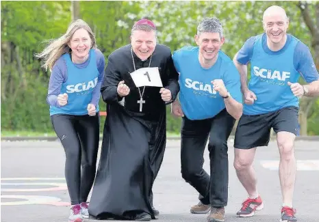  ??  ?? Flashback Bishop John Mone joined charity runners at a SCIAF fundraisin­g event last year