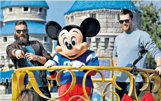  ??  ?? Taking the Mickey: Julian Edelman (left) and Tom Brady celebrate victory at Disney World