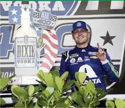  ?? SEAN GARDNER Getty Images ?? William Byron, driver of the No. 24 Axalta Chevrolet, celebrates in Victory Lane after winning the NASCAR Cup Series Dixie Vodka 400 at Homestead-Miami Speedway on Sunday. Byron, who led a race-high 102 laps out of 267, took the lead for good after Lap 210.