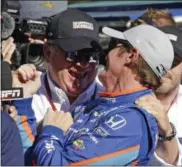  ?? MICHAEL CONROY — THE ASSOCIATED PRESS ?? Scott Dixon celebrates with car owner Chip Ganassi after winning the pole for the Indianapol­is 500.