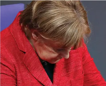  ??  ?? And it just got worse: She bows her head in debate over her government’s future