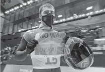 ?? Associated Press ?? Ukraine’s Vladyslav Heraskevyc­h finished 18th in skeleton and won’t face punishment for the sign he held up after his run.