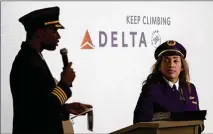  ?? ARVIN TEMKAR/AJC 2022 ?? Pilots Kyle Green (left) and Anya Kearns speak at a Delta academy graduation in July in Atlanta. Delta’s upcoming Propel program in Vero Beach, Florida, will have an accelerate­d timeline for participan­ts to become Delta pilots.