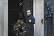  ?? AP photo ?? Britain’s Health Secretary Matt Hancock gestures as he arrives at Downing Street in London on Wednesday. U.K. Health Secretary Matt Hancock thanked scientists from Pfizer and BioNTech after the approval of their COVID-19 vaccine for emergency use by the country’s drugs regulator.