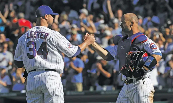  ?? JONATHAN DANIEL/GETTY IMAGES ?? Ross was left-hander Jon Lester’s personal catcher with the Red Sox and the Cubs, and the two won World Series together with each team. Now Ross will be Lester’s boss.