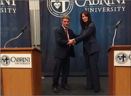  ?? LINDA STEIN - MEDIANEWS GROUP ?? Jack Stollsteim­er and Katayoun Copeland shake hands before the debate at Cabrini University. The pair are vying for the position of Delaware County District Attorney, which Copeland now holds.