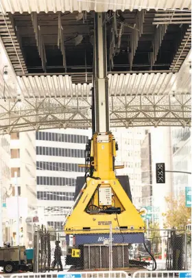  ?? Scott Strazzante / The Chronicle ?? Hydraulic jacks help support the new Transbay center above Fremont Street in San Francisco where cracks in girders were discovered and must be fixed.