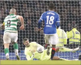  ??  ?? Celtic’s Fraser Forster saves Alfredo Morelos’ penalty