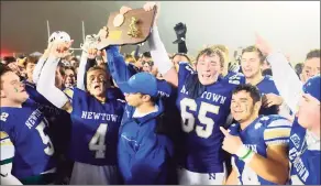  ?? Hearst Connecticu­t Media file photo ?? The Newtown football team celebrates its 13-7 win in the CIAC Class LL football championsh­ip on Dec. 14, 2019.
