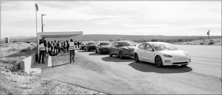  ?? SCOTT JACOBS / EDMUNDS VIA AP ?? Five electric vehicles are seen at a test track in the Mojave Desert, in California, undergoing testing for maximum range.