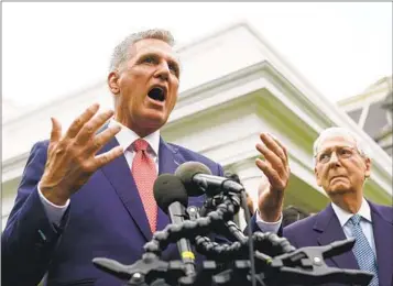  ?? MANUEL BALCE CENETA AP ?? House Speaker Kevin McCarthy and Senate Minority Leader Mitch McConnell talk to reporters after meeting with President Joe Biden and Democratic congressio­nal leaders at the White House Tuesday.