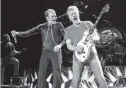  ?? GREG ALLEN Invision/AP file ?? Eddie Van Halen, right, performs with David Lee Roth and the band in New York in 2015.