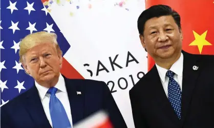  ?? Photograph: Brendan Smialowski/AFP/Getty Images ?? Donald Trump and Xi Jinping at the G20 summit in Osaka in June.