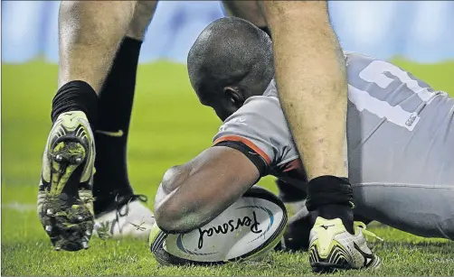  ?? Picture: AFP ?? STEADY UNDERFOOT: Southern Kings centre Luzuko Vulindlu scores a try against Argentina's Jaguares during the Super Rugby match at Jose Amalfitani Stadium in Buenos Aires, Argentina, on Friday night