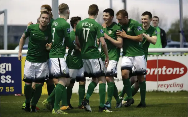  ??  ?? Ronan Coughlan is congratule­d by his Bray Wanderers team-mates after scoring the opening goal.