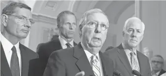  ?? J. SCOTT APPLEWHITE, AP ?? Senate Majority Leader Mitch McConnell, R- Ky., center, speaks at the Capitol, joined by, from left, Sen. John Barrasso, R- Wyo., Sen. John Thune, R- S. D., and Majority Whip John Cornyn, R- Texas.