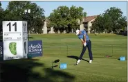  ?? DAVID J. PHILLIP — THE ASSOCIATED PRESS ?? Dustin Johnson tees off at the 11th hole during the first round of the Charles Schwab Challenge golf tournament at the Colonial Country Club in Fort Worth, Texas, Thursday.