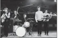  ?? (AP file photos) ?? The Rolling Stones rehearse in an unknown place in April 1964. The members then included (from left) Brian Jones, Bill Wyman, Charlie Watts, Mick Jagger and Keith Richards. Watts was known for elegant clothing in contrast to his band mates. Here he arrives at the June 2010 Royal Ascot horse racing meeting in Ascot, England.