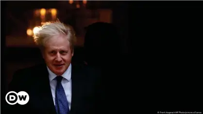  ??  ?? Britain's Prime Minister Boris Johnson walks out of the door at number 10 Downing Street