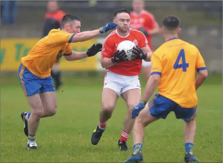  ??  ?? Andrew Smyth of St Bride’s is challenged by Ciaran Clarke and Cormac Bellew of Kilkerley. Pictures: Ken Finegan/Newspics CTI Business Solutions IFC Group B