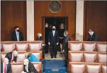  ?? ANNA MONEYMAKER / THE NEW YORK TIMES ?? Paul Irving, then Senate and House Sergeant at Arms, enters the House chamber at the Capitol on Jan. 6 as a joint session of Congress prepared to certify the 2020 Electoral College results. Irving has said nothing publicly about the response to the riot. As violence grew out of control Jan. 6, the head of the Capitol Police made an urgent request for the National Guard, but it took nearly two hours to be approved.