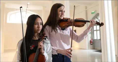  ??  ?? Kay Poole (16) and Fionnghual­a Drumgoole (16) members of Nós Nua a Louth youth folk Orchestra pictured here at the launch of Fleadh Cheoil na hÉireann today.