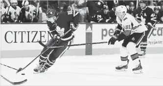  ?? RICHARD LAUTENS TORONTO STAR ?? Maple Leafs’ Mitch Marner does some fancy skating to get around Ottawa Senators’ Mark Stone in Toronto on Wednesday night. Zach Hyman, Andreas Johnsson, Auston Matthews, John Tavares and Morgan Rielly scored for the Leafs in a 5-4 Toronto victory. Magnus Paajarvi, with a pair, Matt Duchene and Thomas Chabot replied for Ottawa. For complete coverage and more NHL news, see therecord.com.