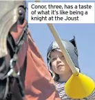  ??  ?? Conor, three, has a taste of what it’s like being a knight at the Joust