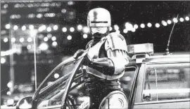  ?? Deana Newcomb ?? THE THEME for “RoboCop” had a stern brass march over glinting electronic­s.
