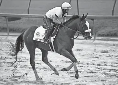  ?? JAMIE RHODES/USA TODAY SPORTS ?? An exercise rider works Kentucky Derby entry Tiz the Law at Churchill Downs.