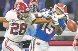  ?? BRYNN ANDERSON/ASSOCIATED PRESS FILE PHOTO ?? Alabama defensive back Josh Jobe breaks up a pass intended for Florida wide receiver Jacob Copeland on Dec. 19 in the SEC championsh­ip in Atlanta. The Crimson Tide are trying to get in the CFP championsh­ip game for the fifth time in six seasons.