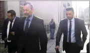  ?? Picture: Chevon Booysen ?? CONVICTED: Ivor Carolissen and Tom-Ross Fortuin, flanked by their lawyer, leave the Cape Town Regional Court yesterday after receiving suspended prison sentences. Their co-accused Thomas Bloemeris-Fortuin immediatel­y started serving his three-year prison sentence.