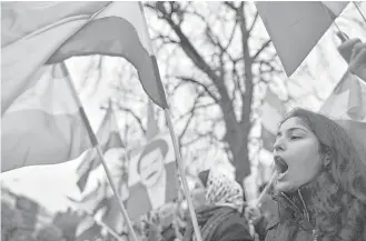  ?? Ben Stansall / AFP / Getty Images ?? Protesters gather outside the Iranian Embassy in London on Tuesday in support of national demonstrat­ions in Iran against the entire political establishm­ent.