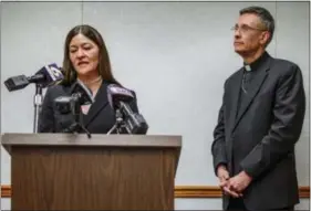  ?? ANDREW RUSH — PITTSBURGH POST-GAZETTE VIA AP, FILE ?? FILE – In this file photo, acting U.S. Attorney Soo Song, left, joined by Bishop Mark Bartchak, right, of the Diocese of Altoona-Johnstown, discusses new measures to protect children in the Pennsylvan­ia diocese from sexual abuse and better assist...