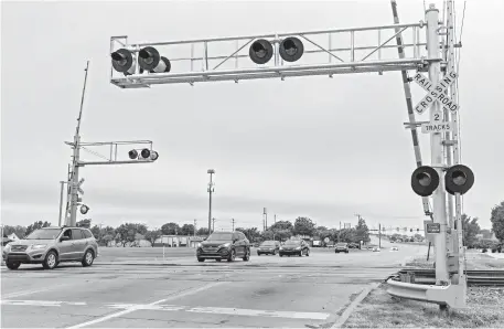  ?? [CHRIS LANDSBERGE­R PHOTOS/ THE OKLAHOMAN] ?? SE 4th, also State Highway 37, carries traffic east and west across the community of Moore.