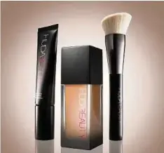  ??  ?? The foundation, primer and brush set from Huda Beauty.