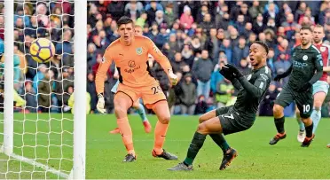  ?? — AFP ?? Manchester City’s Raheem Sterling sends a shot wide to miss a chance against Burnley in their Premier League match at Turf Moor in Burnley on Saturday. The match ended in a 1-1 draw.