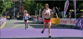  ??  ?? Ciara Wilson crossing the line after finishing fifth in last year’s VFI mini-marathon.