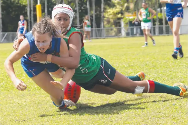  ?? Picture: ANNA ROGERS ?? TOUGH CONTEST: Centrals’ Brooklyn Lancaster is tackled by Souths’ Shantel Ripia during the Centrals Trinity Beach v South Cairns match.