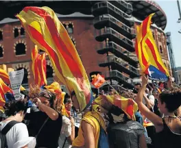  ?? /Reuters ?? Banned vote: Students wear Esteladas (the Catalan separatist flag) during a demonstrat­ion in Barcelona, Spain. Catalan separatist­s urged supporters on Thursday to defy Spanish government efforts to block an independen­ce referendum on Sunday.