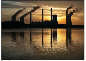  ?? (AP file photo) ?? The coal-fired Scherer Power Plant, one of the nation’s top carbon dioxide emitters, is shown in Juliette, Ga. The Biden administra­tion is trying to reduce the U.S.’ use of coal and other fossil fuels as part of the effort to fight climate change.