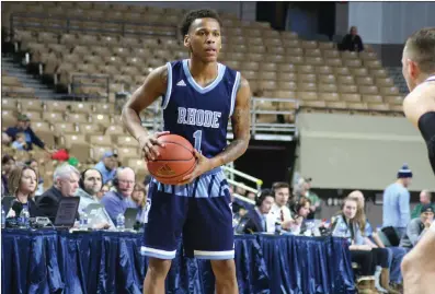  ?? Photo by Colby Cotter / SRI Newspapers ?? URI guard Fatts Russell (1) struggled from the 3-point line again Saturday against Holy Cross, but the sophomore was solid from the foul line to score a team-high 19 points in the 79-63 victory at the DCU Center.