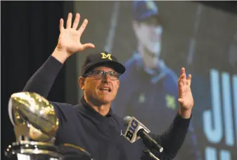  ?? G-Jun Yam / Associated Press ?? Michigan and head coach Jim Harbaugh lost three of their last four games last season.