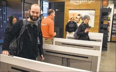  ?? STEPHEN BRASHEAR — GETTY IMAGES ?? After more than a year in beta, Amazon opened the cashier-less store to the public Monday in Seattle.