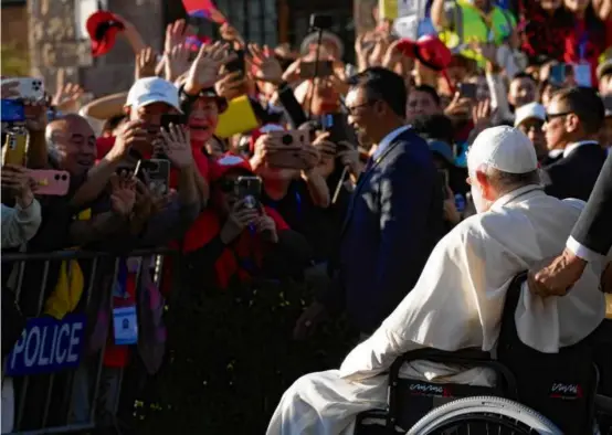  ?? ANDREW MEDICHINI/ASSOCIATED PRESS ?? Sitting in a wheelchair, Pope Francis left a cathedral in Ulaanbaata­r, Mongolia, Saturday after a meeting with the local clergy.