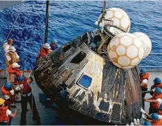  ?? NASA ?? The Apollo 13 Command Module is hoisted aboard the USS Iwo Jima on April 17, 1970.